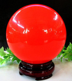 天然冰洲石萤石夜光球夜明珠原石 红色发光球 风水球摆件批发