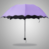 创意遇水开花三折叠晴雨伞黑胶防晒防紫外线超大两用遮阳太阳伞女